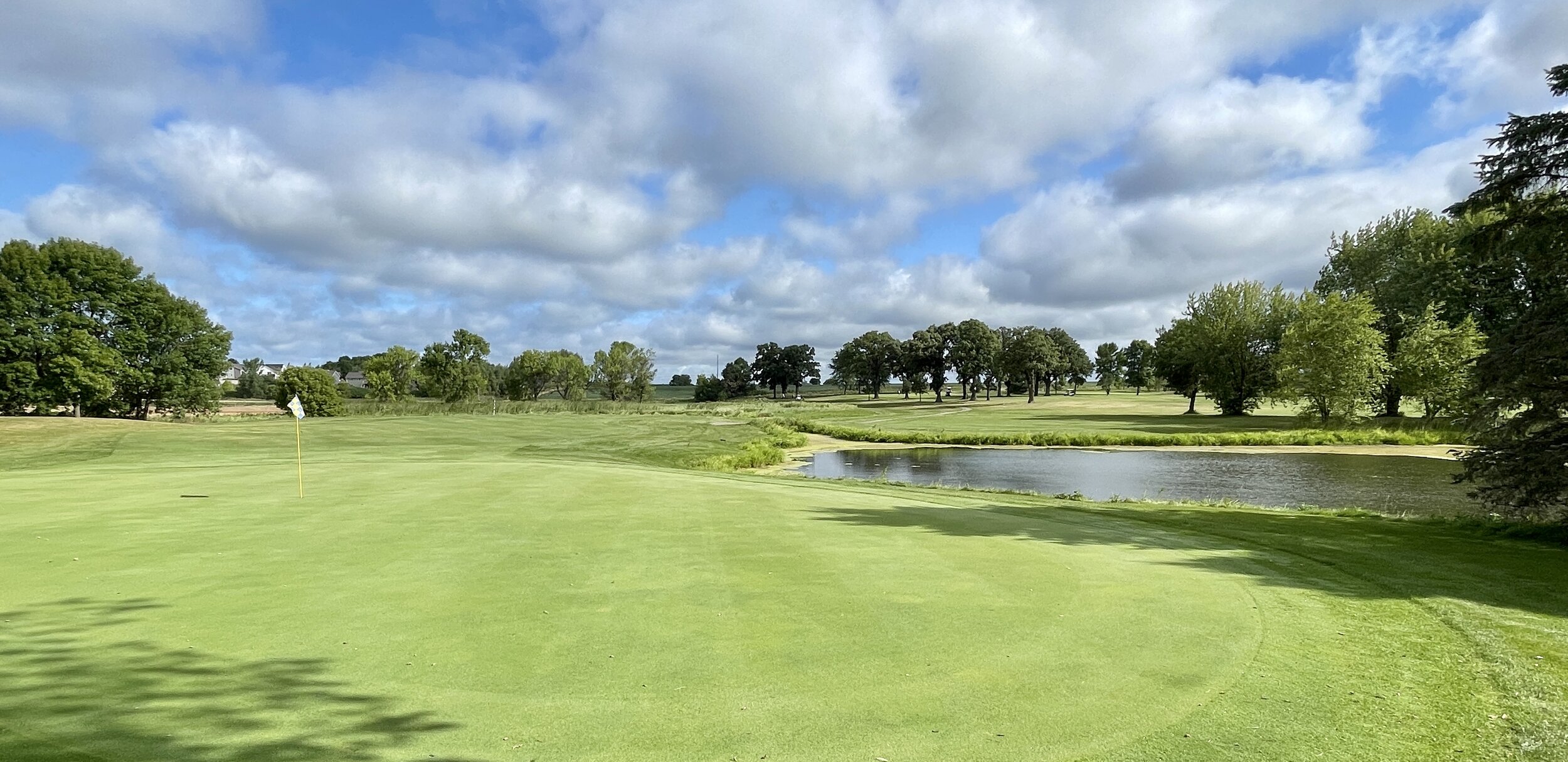 A green with a pond beyond it at Montgomery National Golf Club